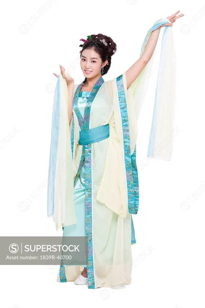 Young woman in Chinese traditional costume dancing