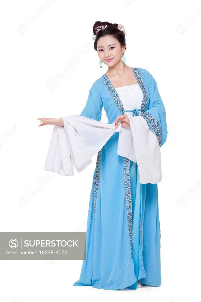 Young woman in Chinese traditional costume greeting