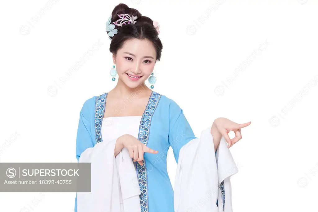 Young woman in Chinese traditional costume pointing away