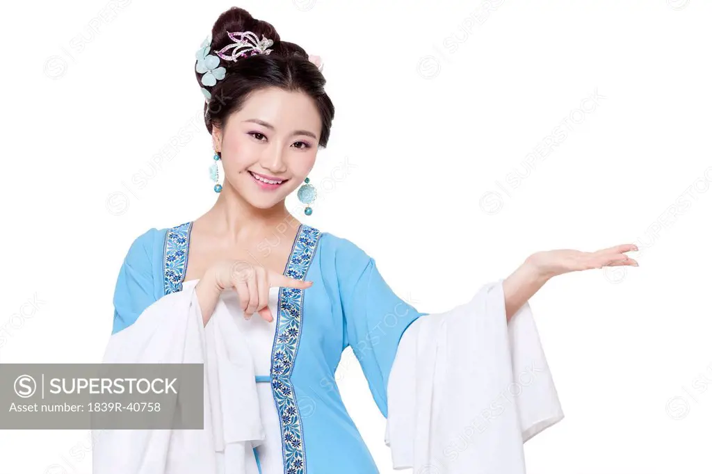 Young woman in Chinese traditional costume gesturing