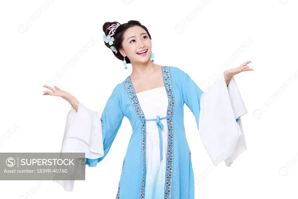 Young woman in Chinese traditional costume gesturing