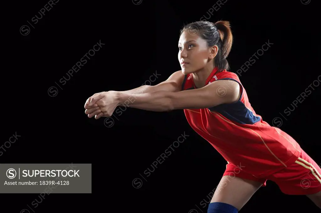 Young Woman Playing Volley Ball
