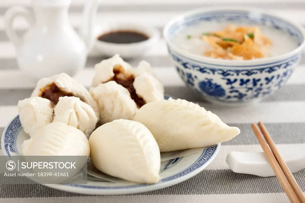 Chinese food rice porridge and cantonese barbecued pork buns