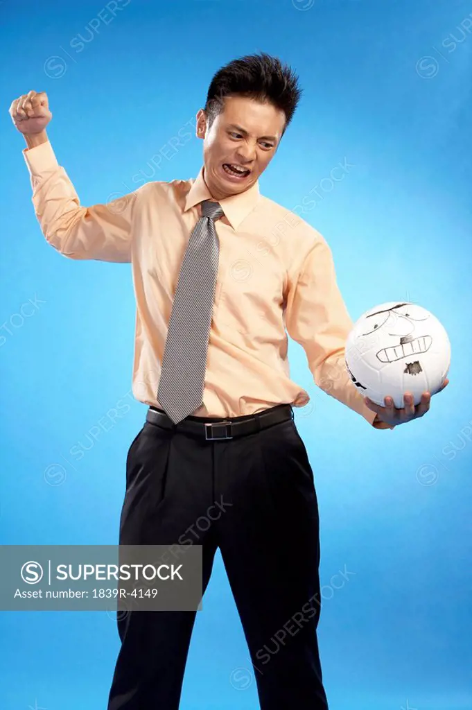 Portrait Of Businessman With Volleyball