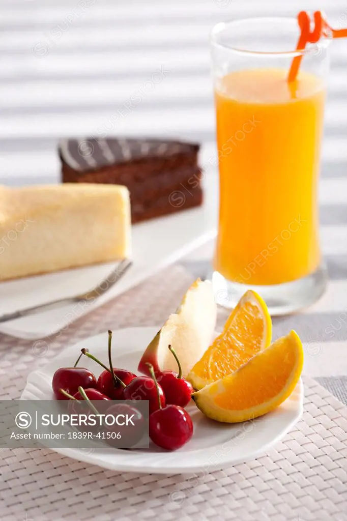 Fruit with juice and cakes