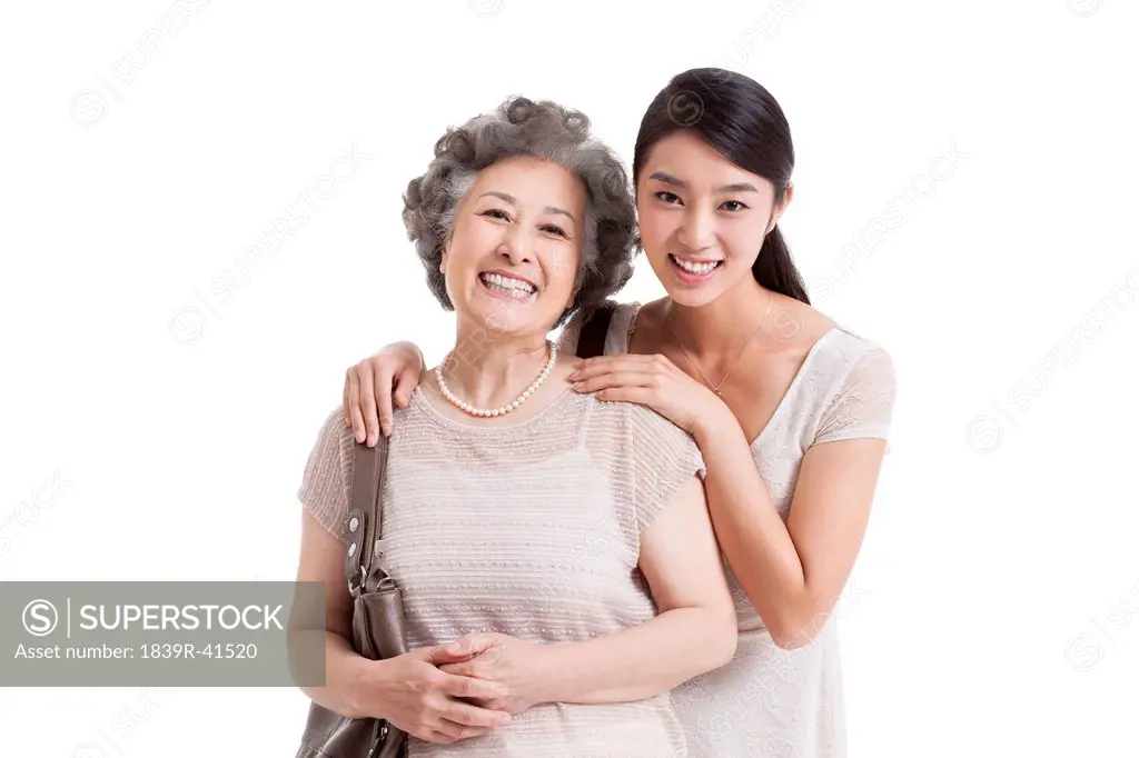 Close senior mother and adult daughter