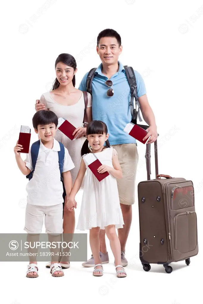 Happy young family going for vacation