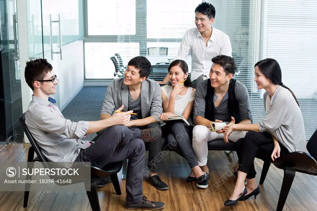 Young office workers holding a meeting