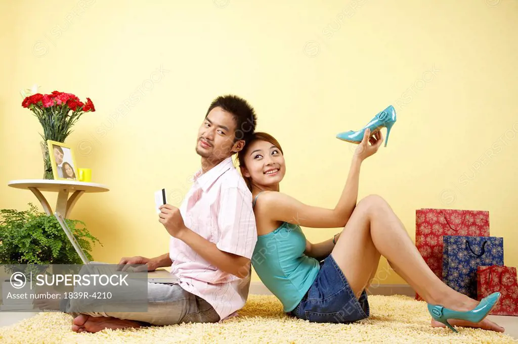 Young Couple Sitting On The Floor