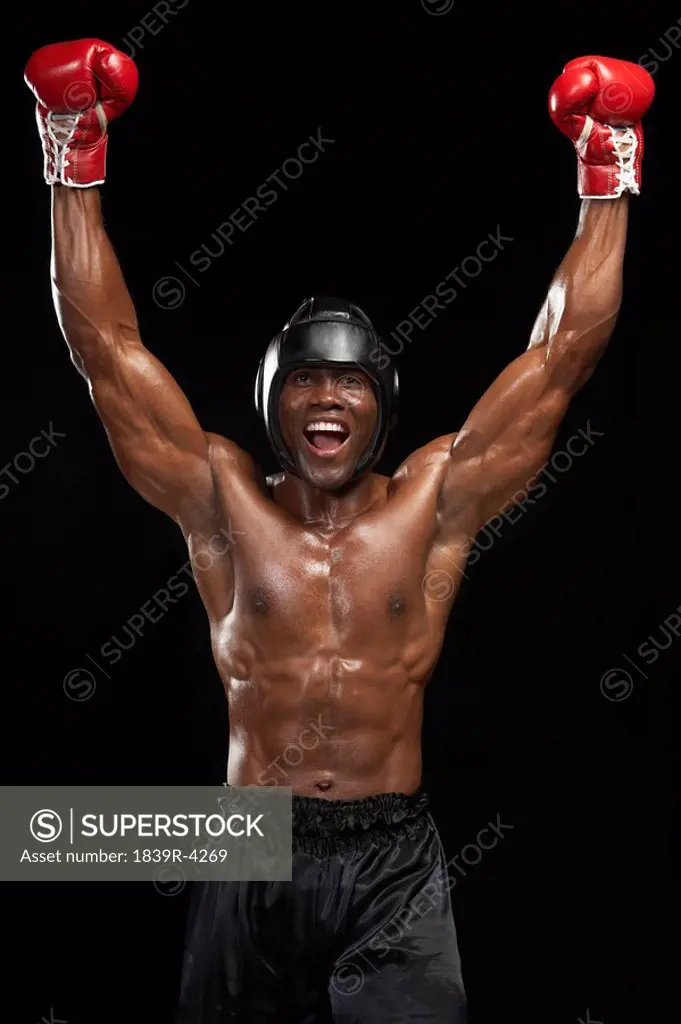 Boxer With Arms Raised Celebrating Victory