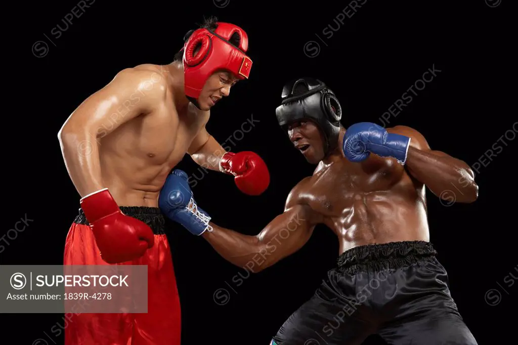 One Boxer Punching Another In The Stomach