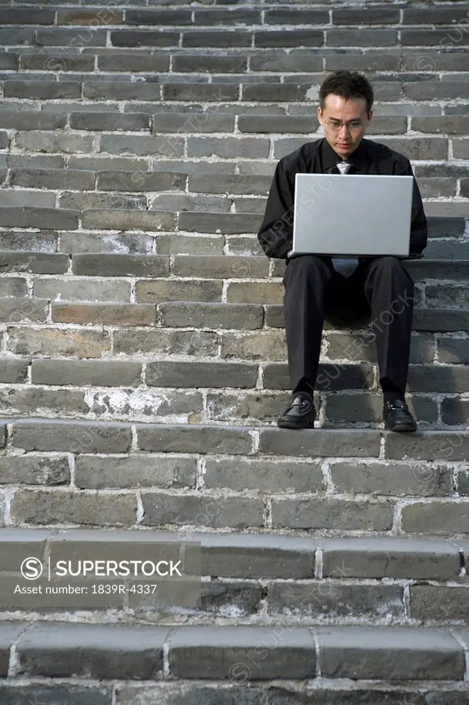 Businessman Typing On Laptop Computer