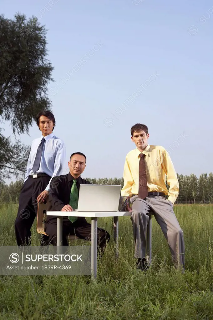 Portrait Of Business People In A Field