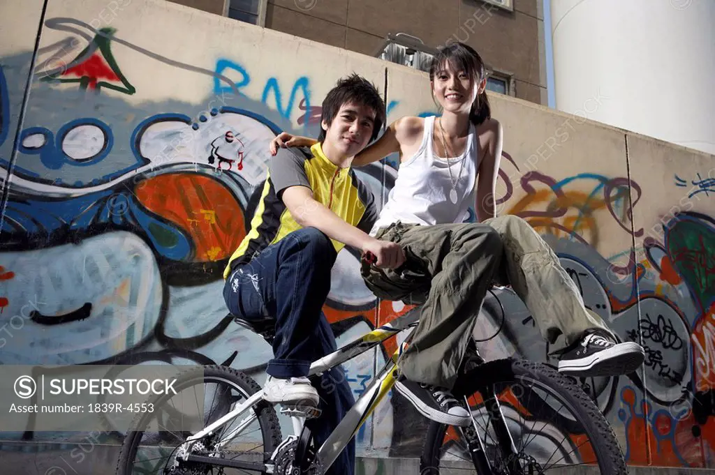 Teenagers Sitting On Bike