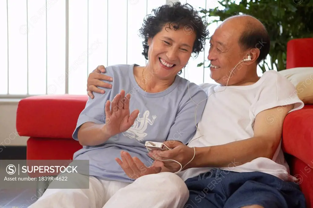 Couple Listening To MP3 Player Together