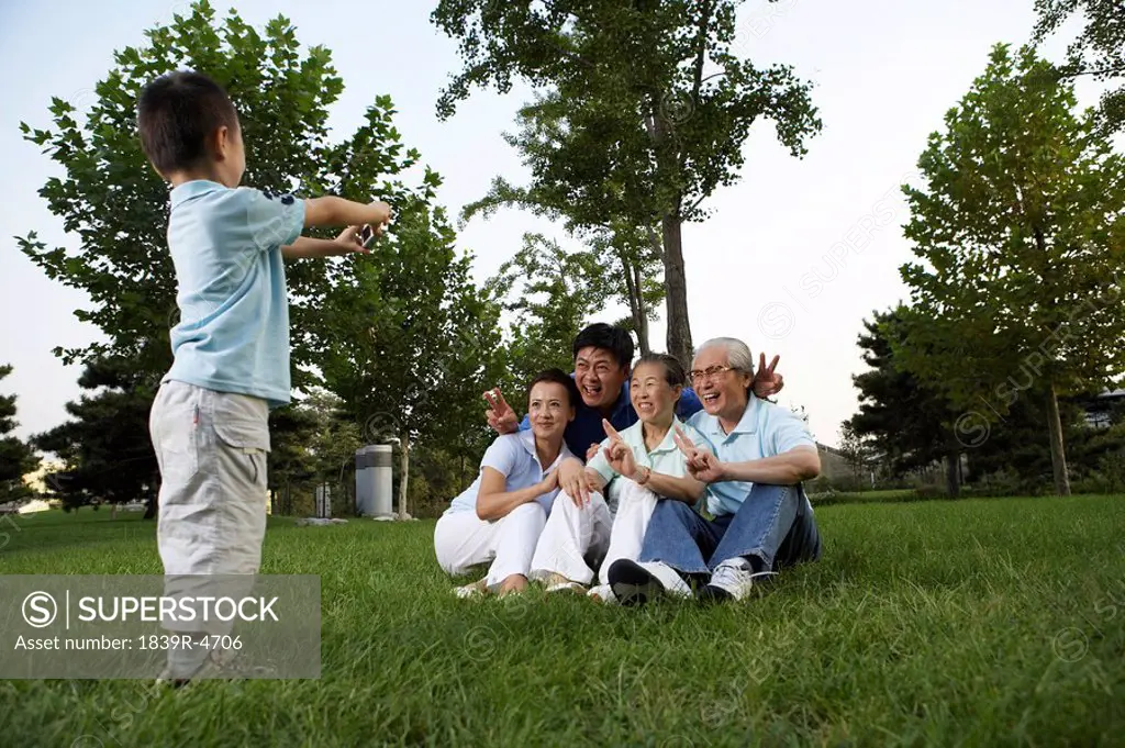 Young Boy Taking A Family Photo