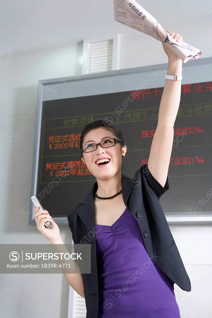 Smiling Businesswoman Raising Hand