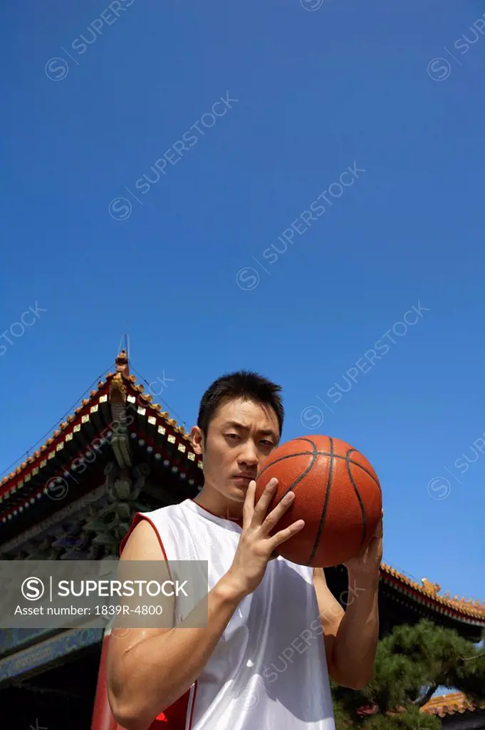 Portrait Of Young Basketball Player In Front Of Temple