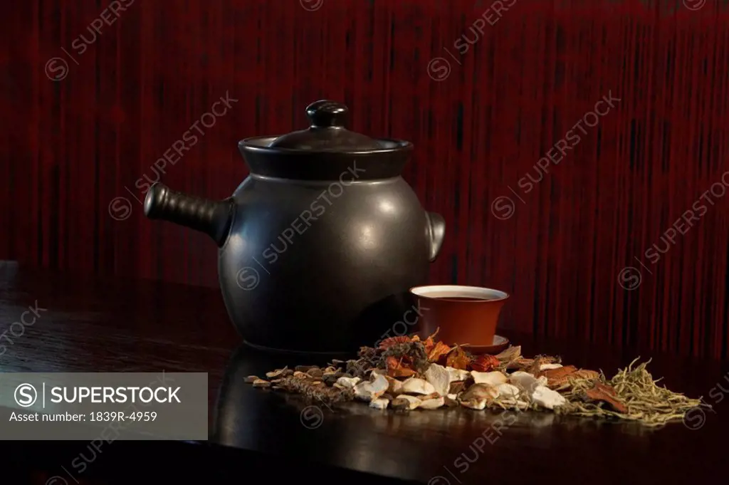 Teapot With Cup And Loose Tea Leaves