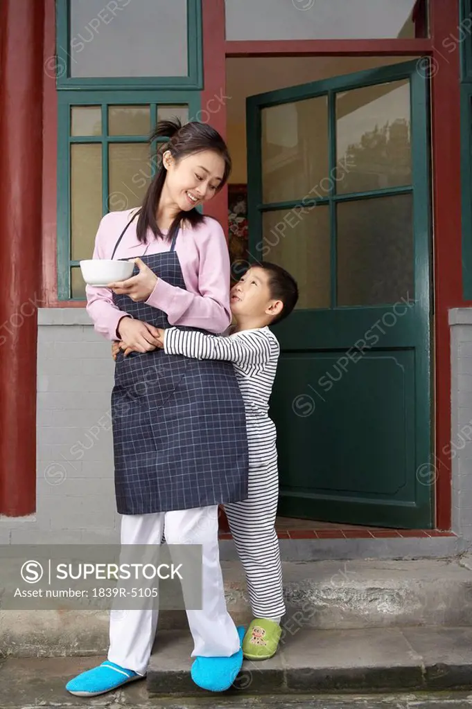 Boy Hugging Mother Round Waist