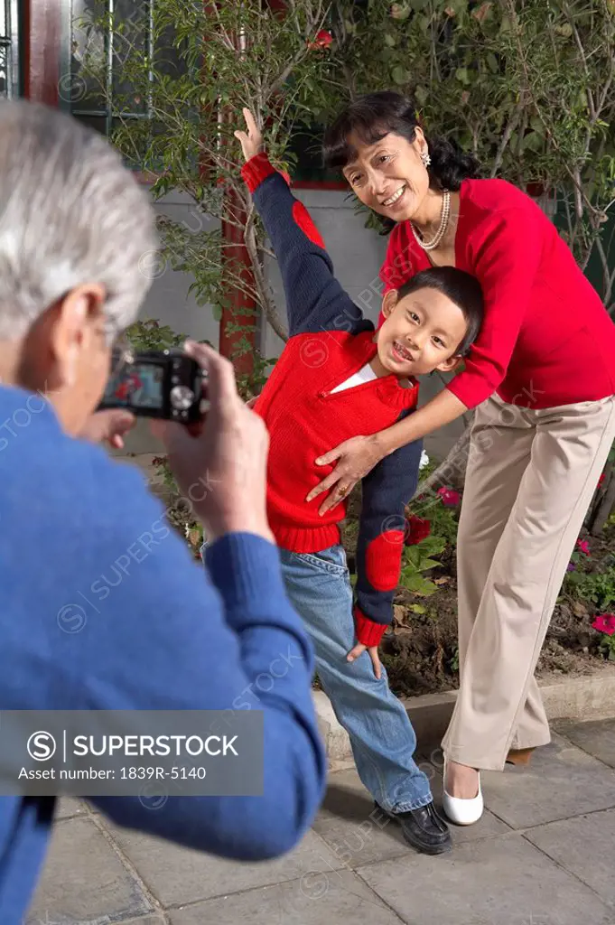Family Taking Photographs Of Each Other