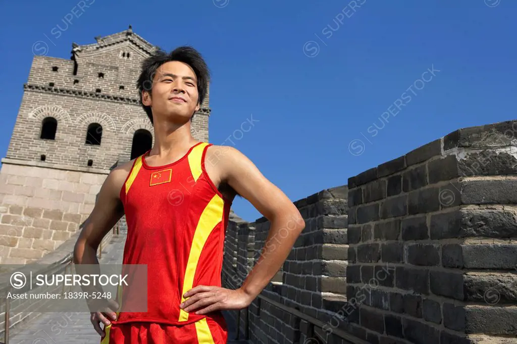 Athlete Standing Proudly On The Great Wall Of China