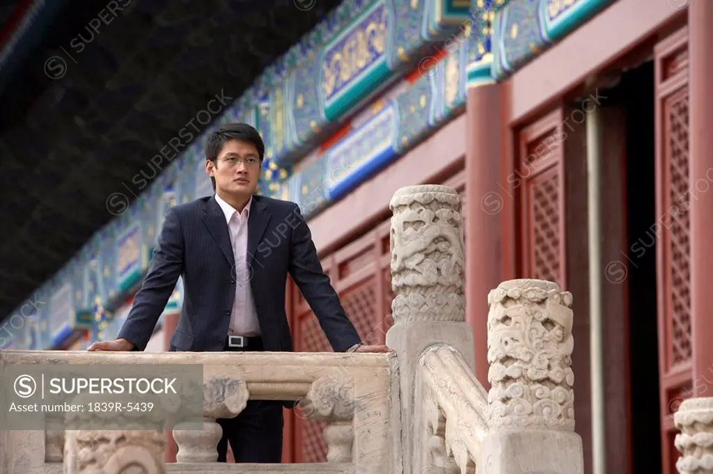 Businessman Standing In The Forbidden City In Beijing
