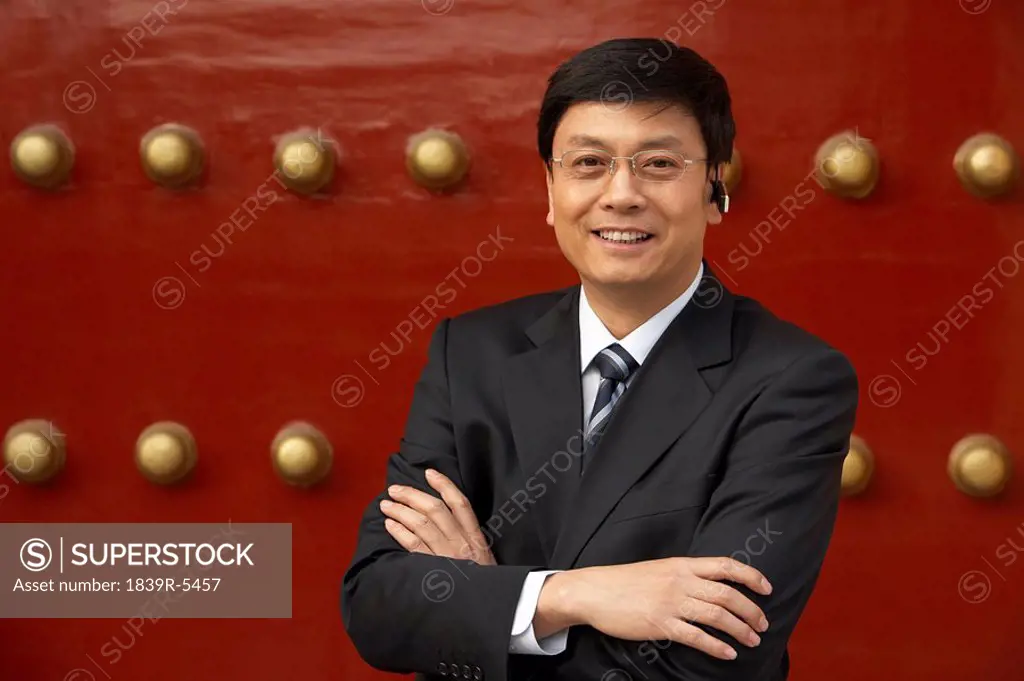 Businessman Standing In The Forbidden City In Beijing