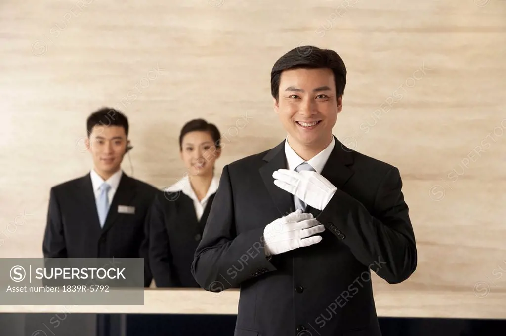 Young Employees Standing In Hotel Reception