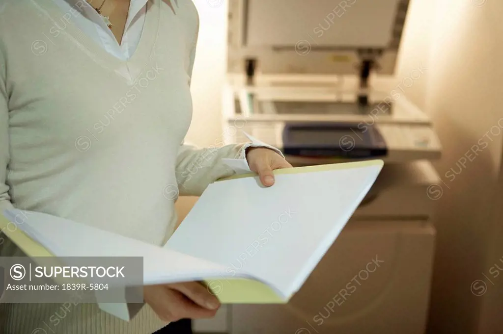 Young Woman Standing In Office