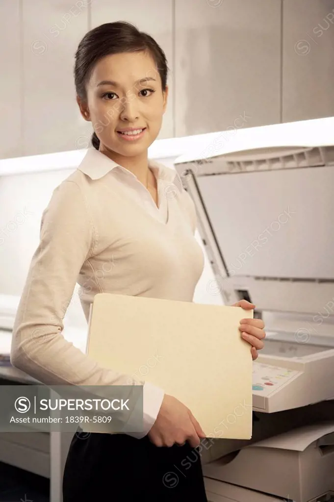 Young Woman Standing In Office