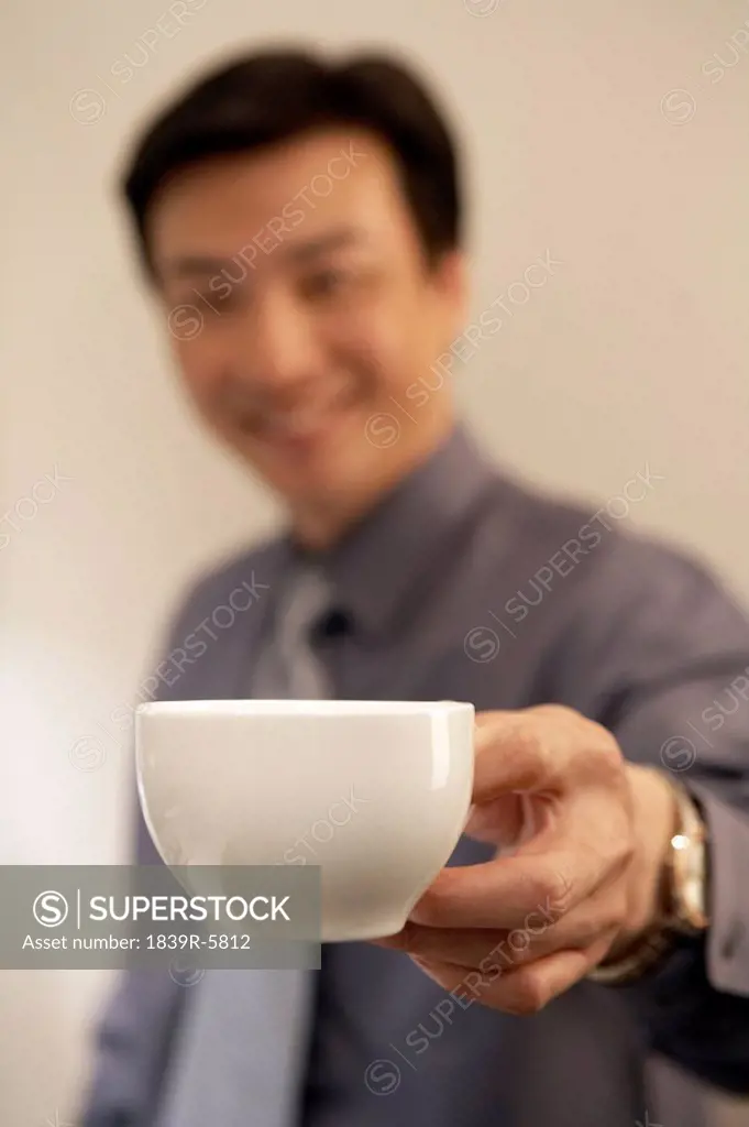 Young Man Holding Coffee Cup
