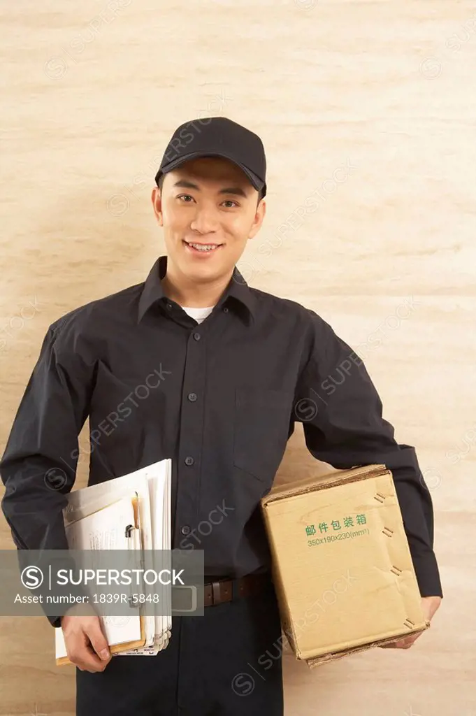 Courier With Clipboard And Parcel