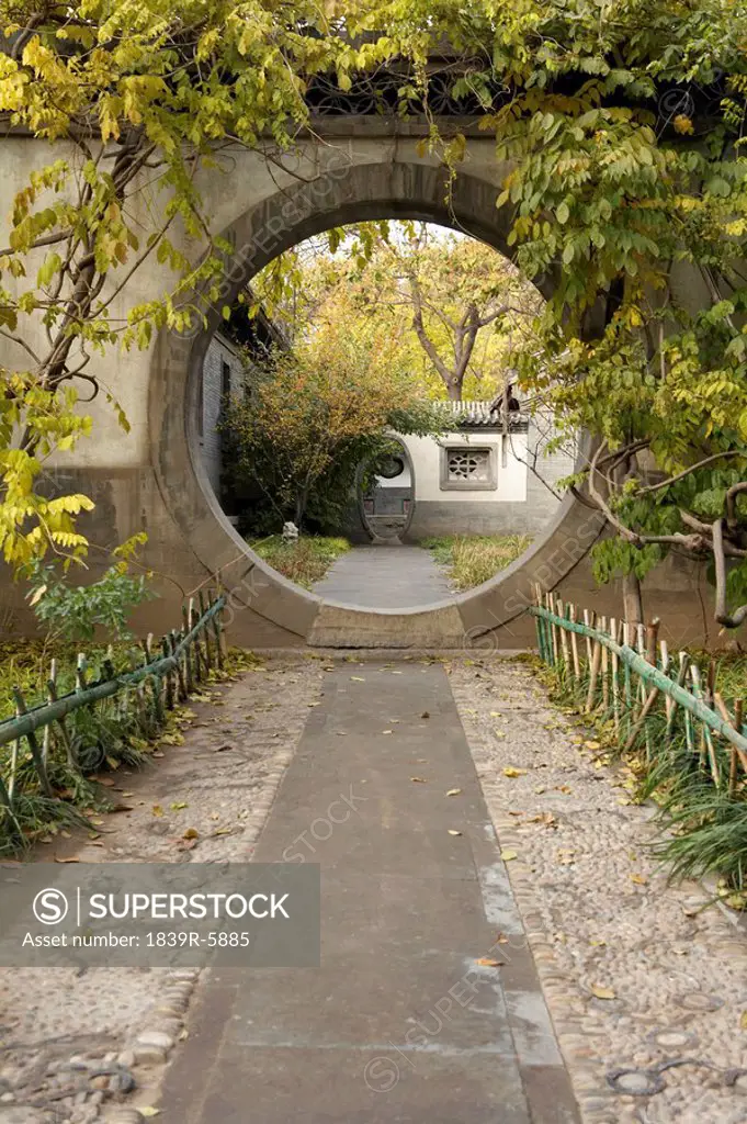 A Traditional Round Entry In A Garden