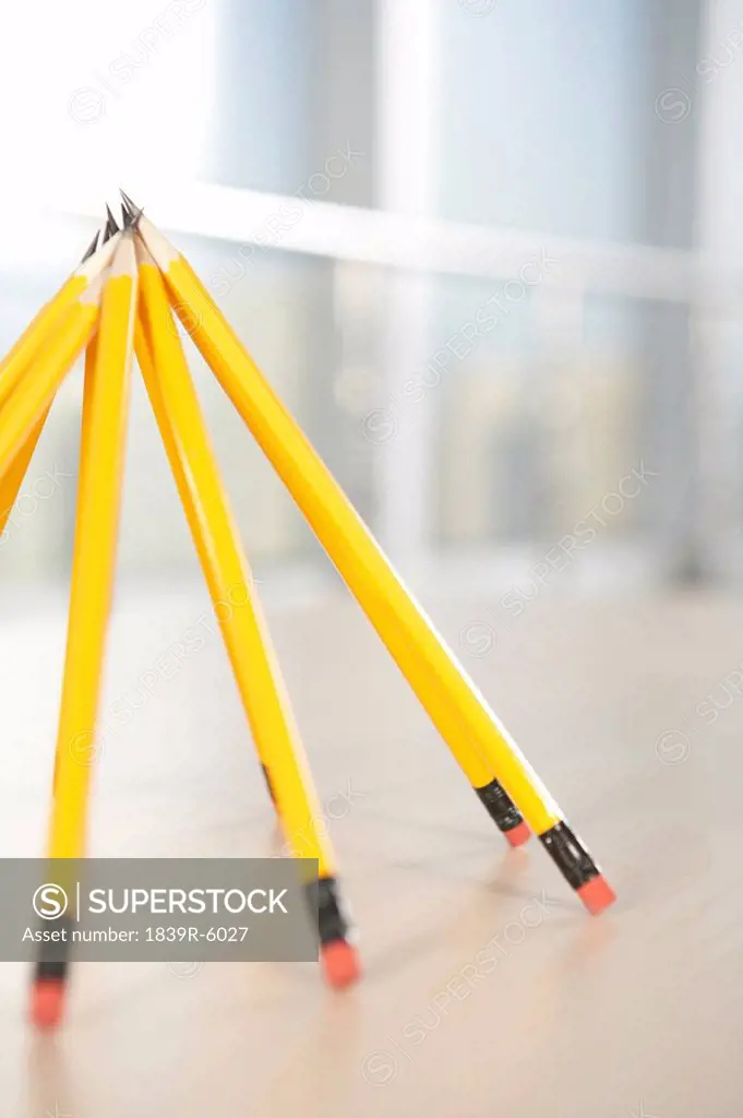 Pencils propped up in a pyramid shape