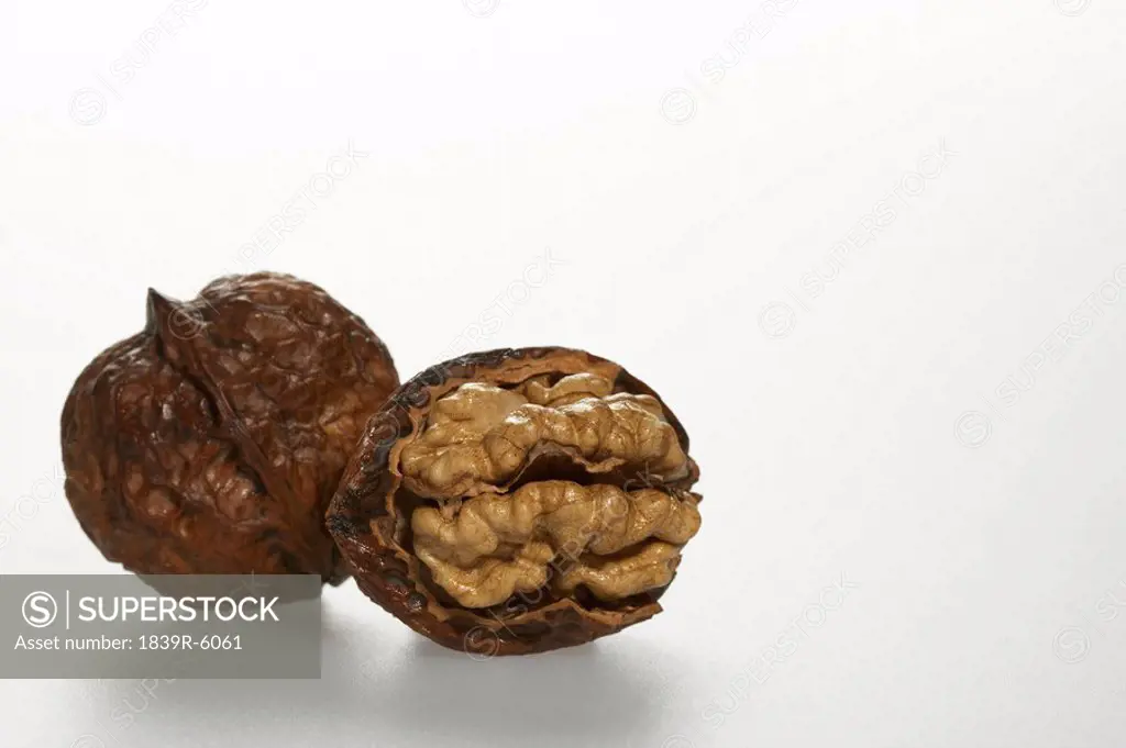 An opened and a whole walnut