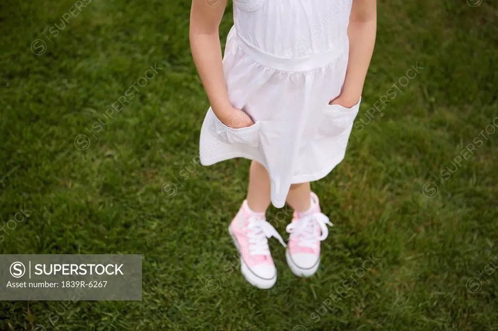 Young Girl Standing In Park