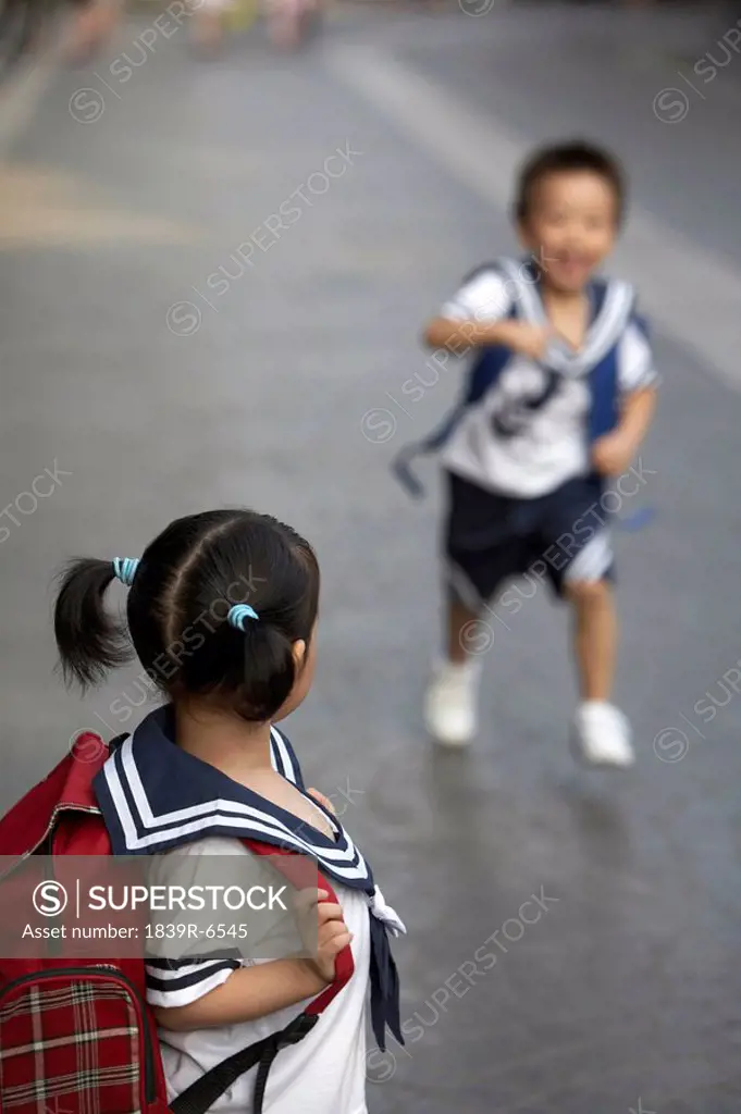 Children in their school uniforms on the way to school