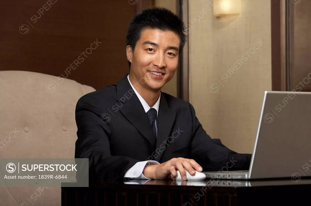 A businessman uses the hotel business center