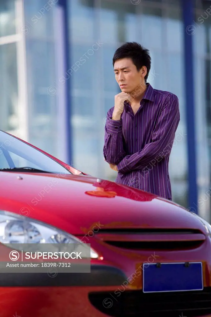 Man with a new car