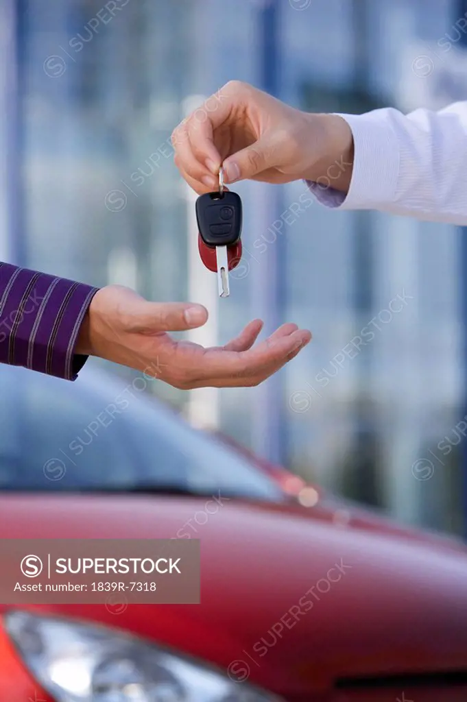 Handing over keys to a new car