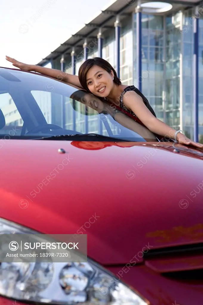 Woman loving her new car