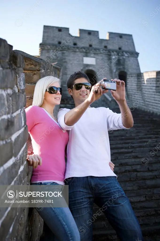 Young couple visiting the Great Wall of China