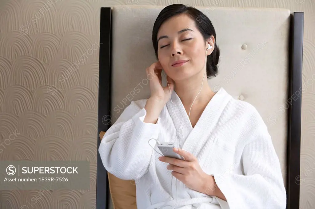 Woman listening to music at a spa