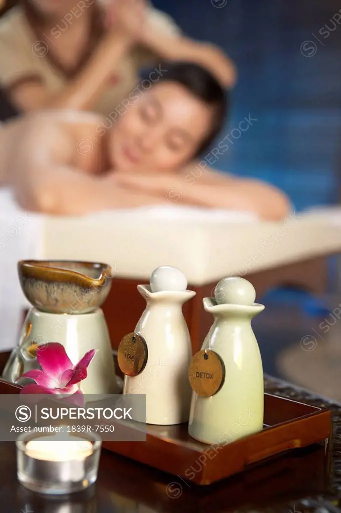 Aromatherapy candle and bottles at a spa
