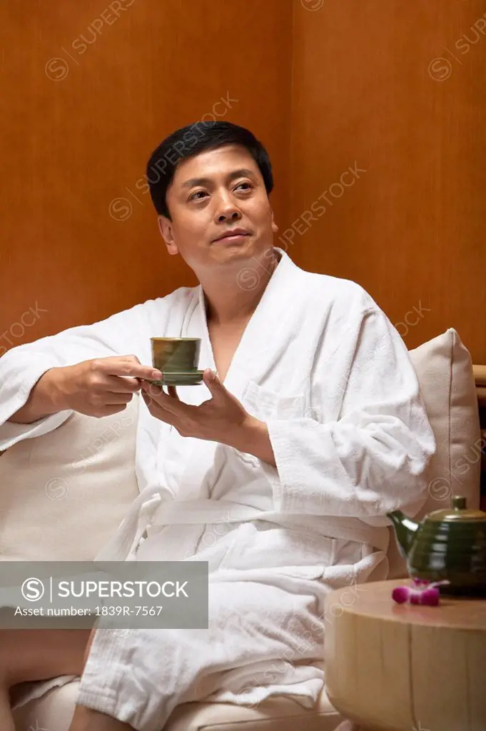 Man drinking tea at a spa