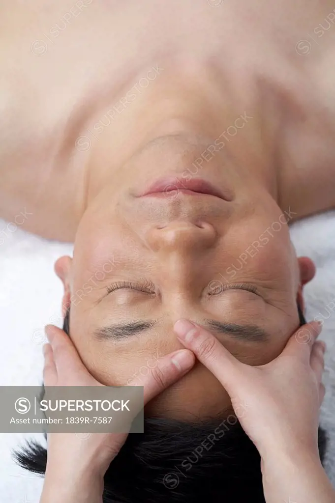 Man receiving a head massage