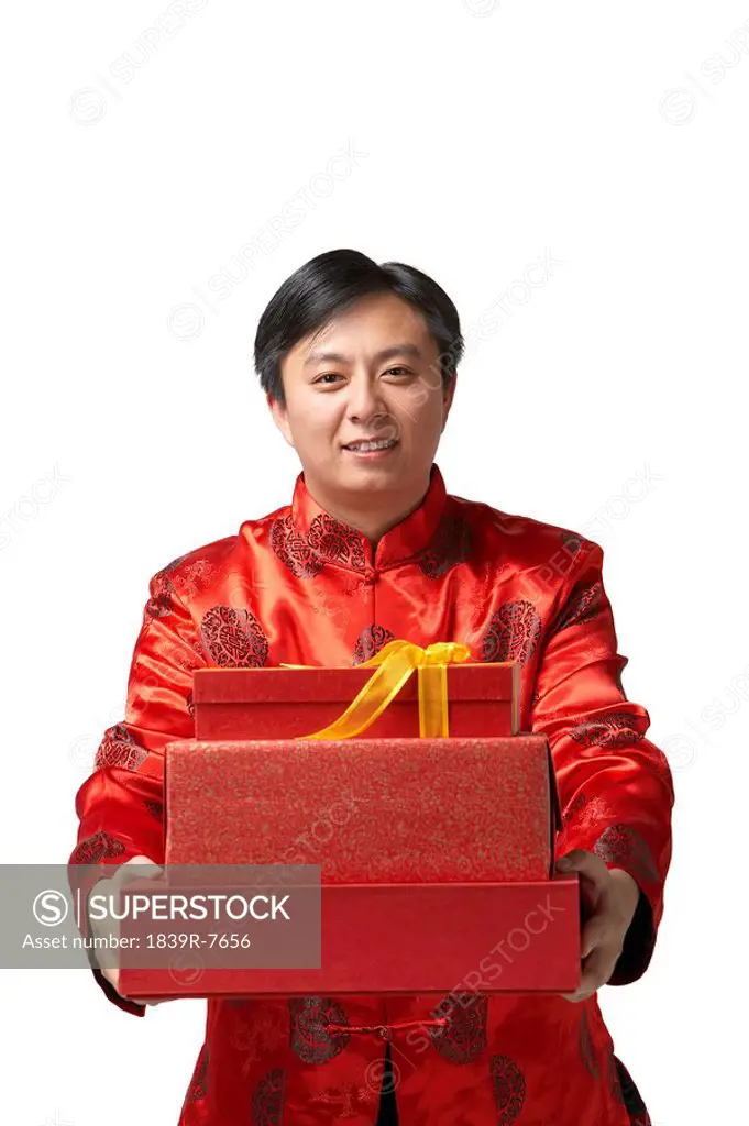 A man holds out Chinese New Year presents