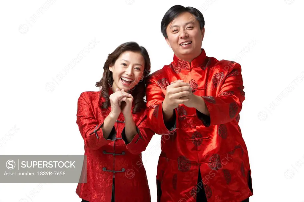 A couple makes a gesture of greeting and good wishes