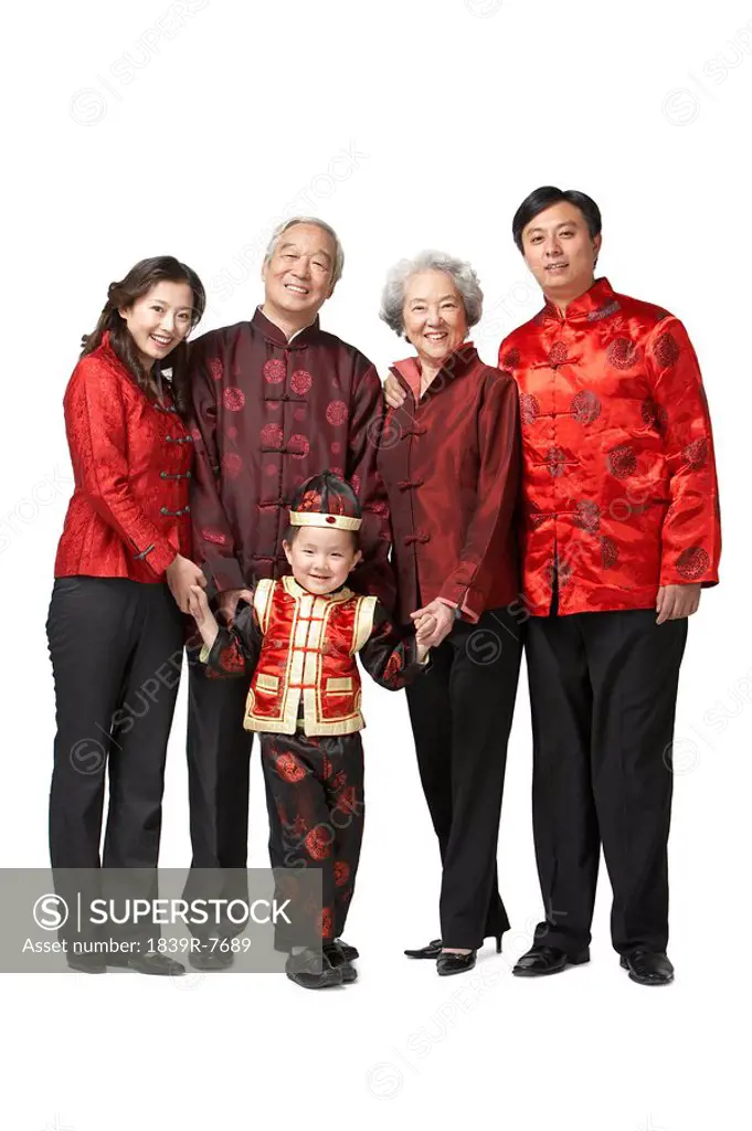 A portrait of a three generational family dressed for Chinese New Year
